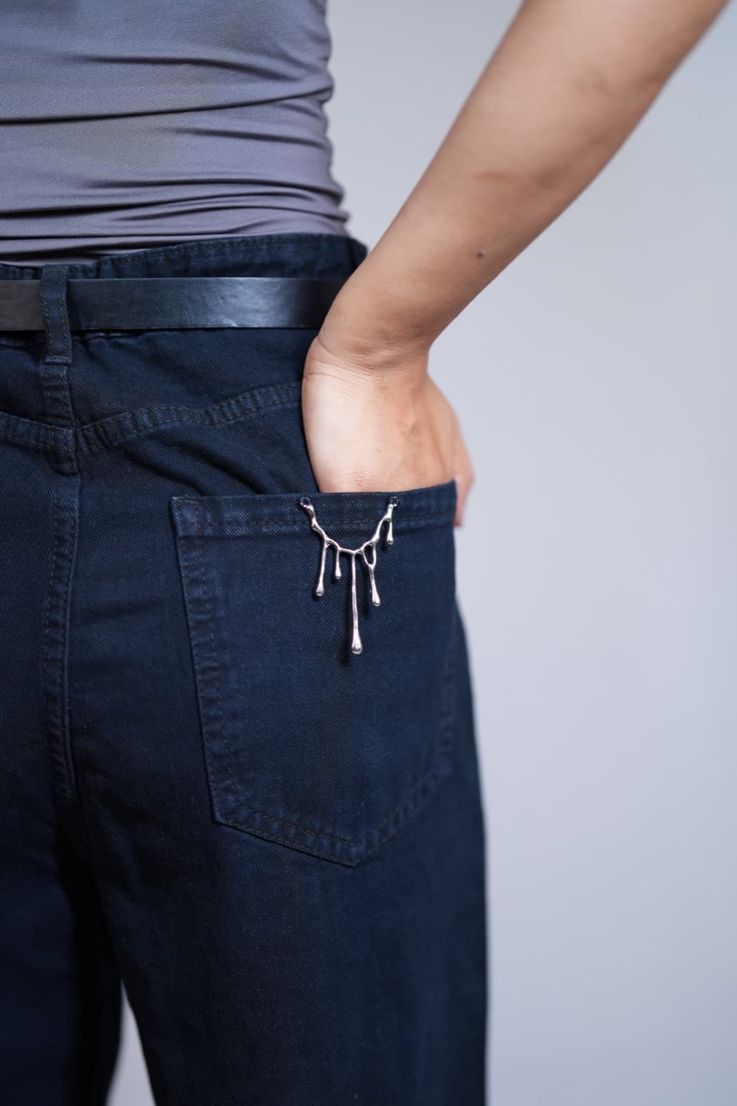 Dark wide-leg denim, pocket detail